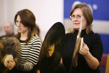 orchestrate music team building activity