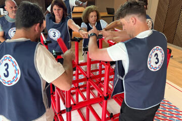 Teams improving collaboration through high-energy workplace challenges