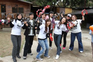 team cheering at the camera for group picture