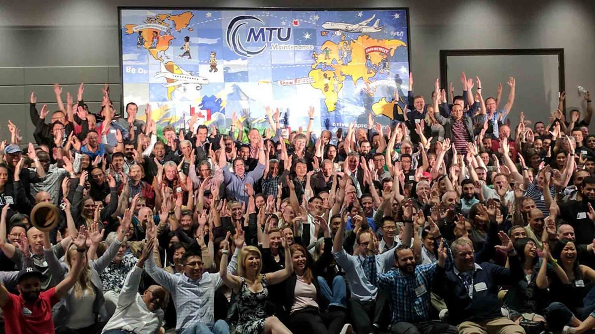 group photo the big picture artistic team building activity at mtu maintenance