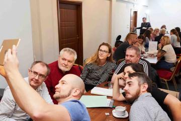 people taking selfie playing impact