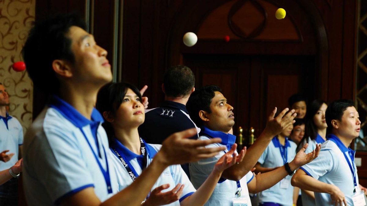 people juggling during team building fun activity juggling motivator