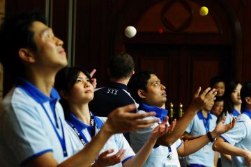 people juggling during team building fun activity juggling motivator