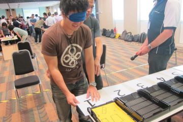 men collaborate to complete bridging the divide creative team building activity