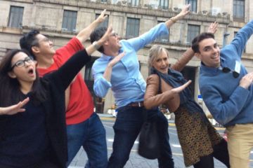 people pointing at the sky go team team building interactive games