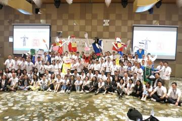 team collaborate to construct a puppet creative team building activity team photo