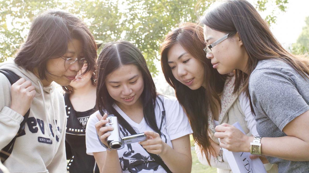 women checking recording of thei hollywood challenge team building task