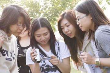 women checking recording of thei hollywood challenge team building task