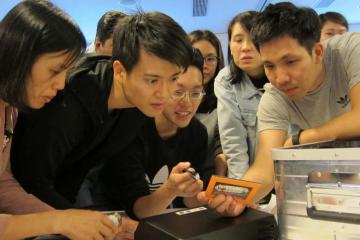 employees collaborate at rewarding team building challenge - new