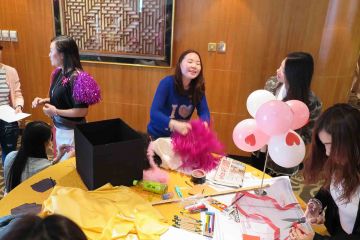 team collaborate to create garments for haute couture team building activity