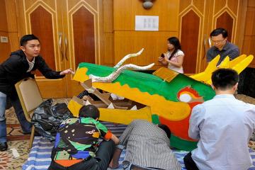 teams collaborate to build a dragon team building CNY activity