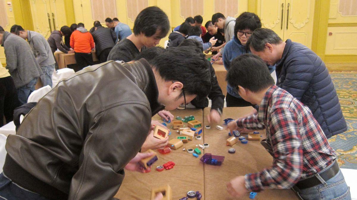 	team collaborate to complete team building challenge beijing