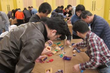 	team collaborate to complete team building challenge beijing