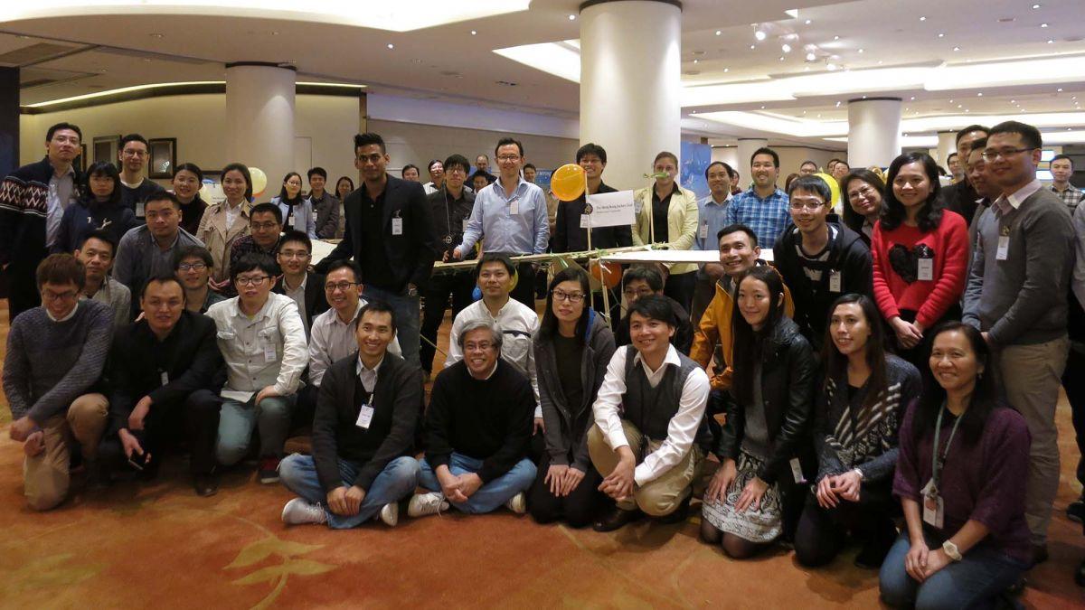 	employees smiling for group picture time man