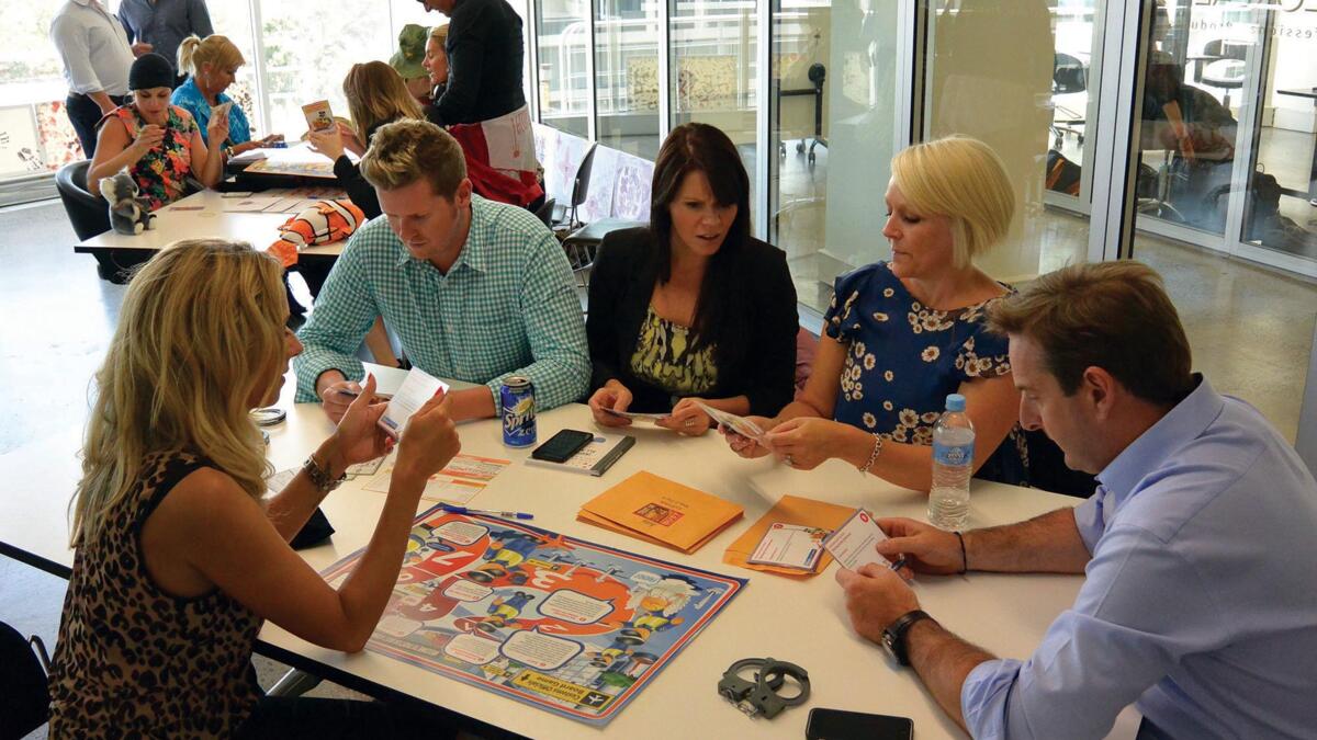 Team collaborating in a customer-focused workshop, discussing strategies to improve client relationships and communication