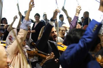 	orchestrate music team building activity