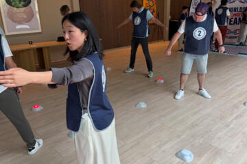 Team members demonstrating resilience and collaboration during a corporate event