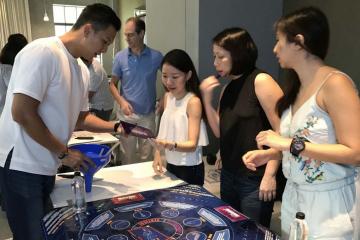 team have fun collaborating during teambuilding activity