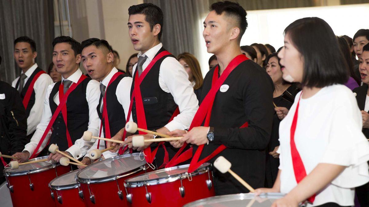 	employees have fun playing instruments beatswork team building activity group