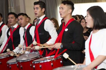 	employees have fun playing instruments beatswork team building activity group