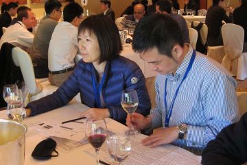 two employees at table during dinner event