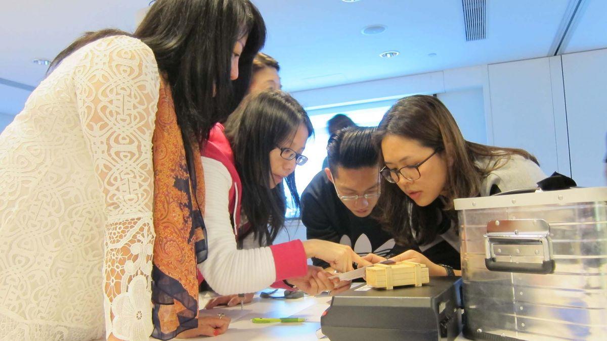 employees collaborating together during team building activity 2010