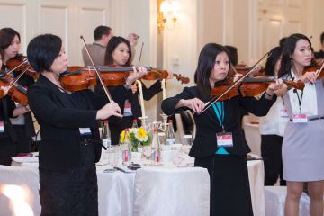 people playing instruments crescendo musical team building activity